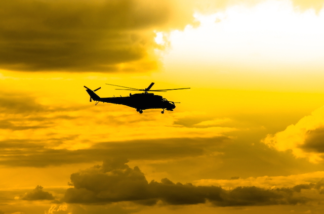 combat helicopters Mi-24 against the sky